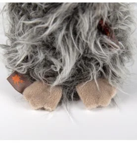 Peluche oiseau "Slow Flyer" signée Sigikid, gros plan sur les pattes