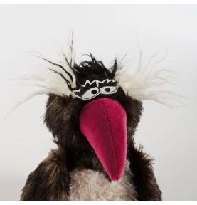 Peluche pingouin "Rock Hopper" signée Sigikid, gros plan sur la tête