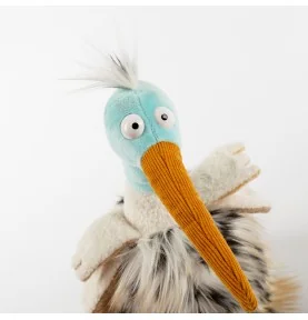 Peluche oiseau "Tobago Tom" signé Sigikid, gros plan sur la tête