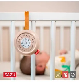 Émetteur de bruit blanc Suzy Deluxe accroché aux barreaux d'un lit bébé Émetteur de bruit blanc Suzy Deluxe accroché aux barreaux d'un lit bébé